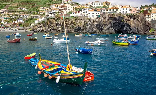 Coastal view of Madeira island with colorful boats